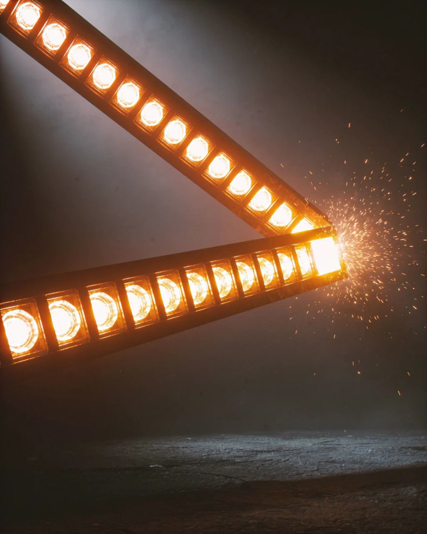 A glowing bar of warm amber light segments filling across a dark plain panel, the last segment flaring bright against a cold dark ground