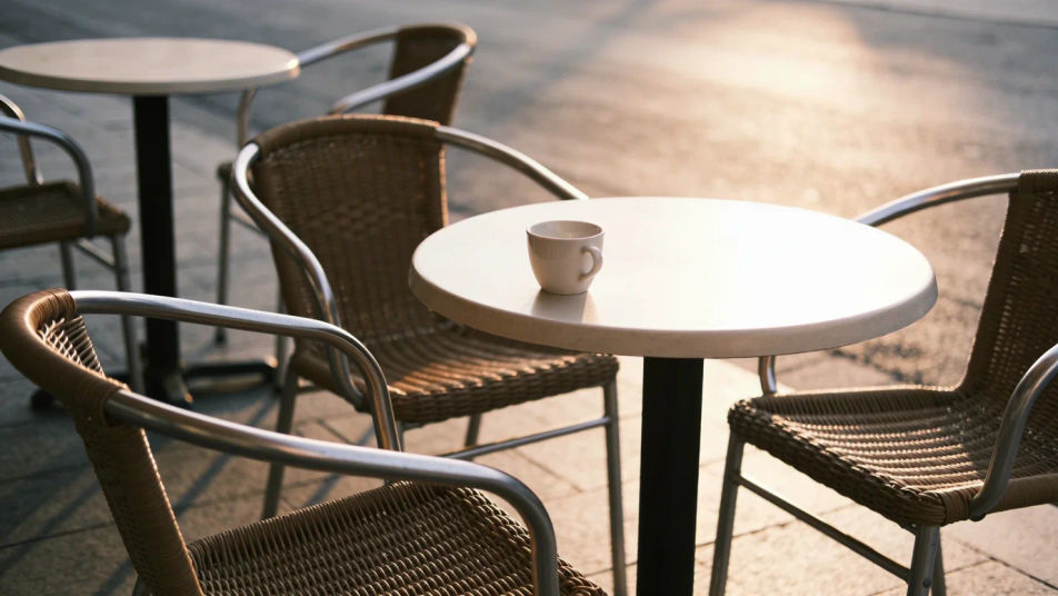 Suggest a café table just off screen