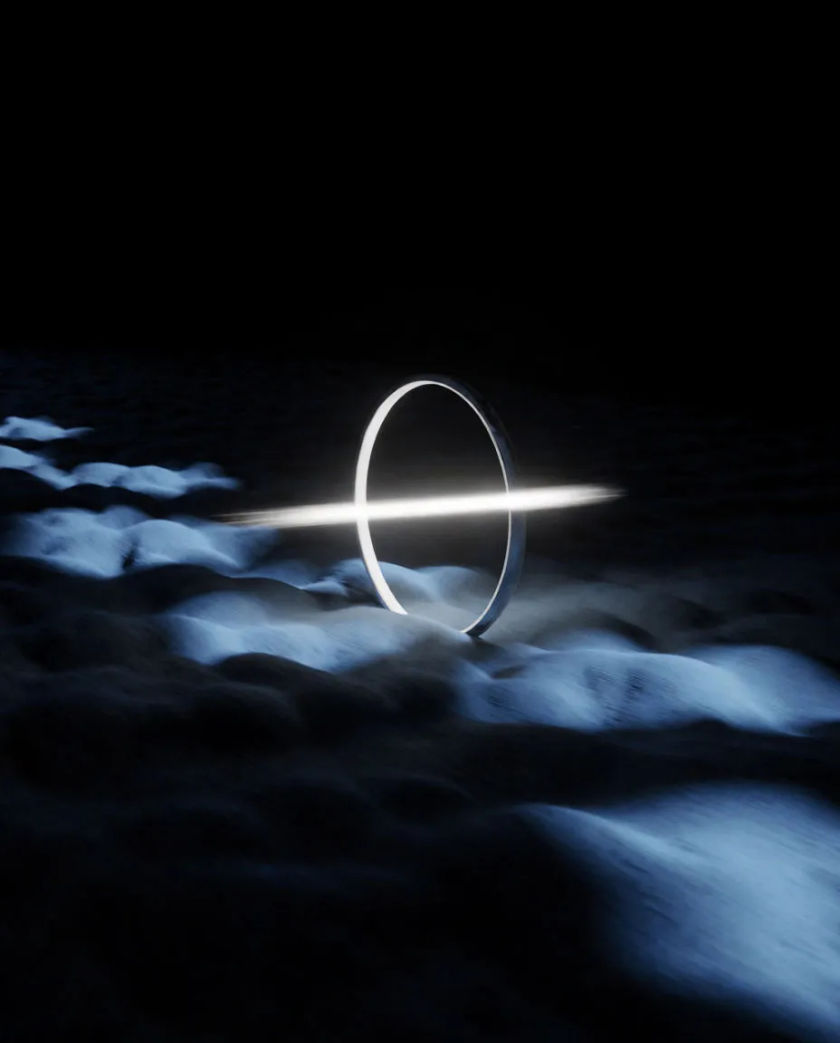 A glowing ring of white light on a dark course with a streak of motion blur crossing through its centre