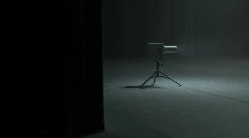 Fill a dark pause with a steady projector hum
