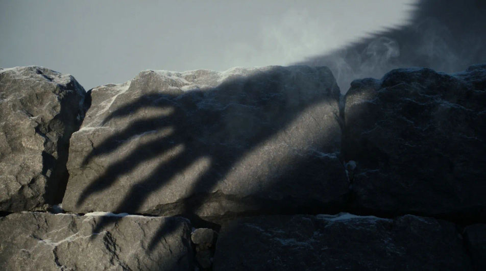 Suggest something huge moving beyond the frame