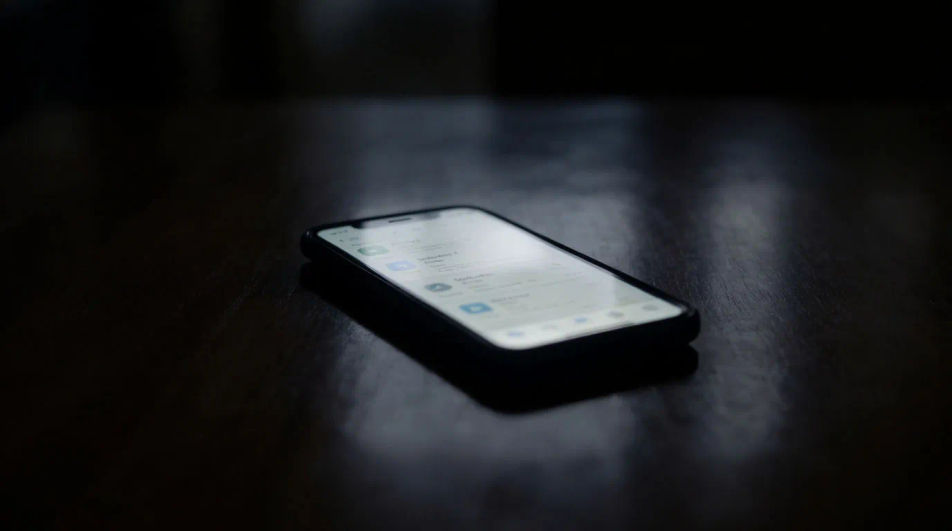 Hint that a phone is lighting up off screen