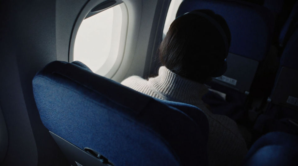 Cover a wordless travel sequence with cabin rush alone
