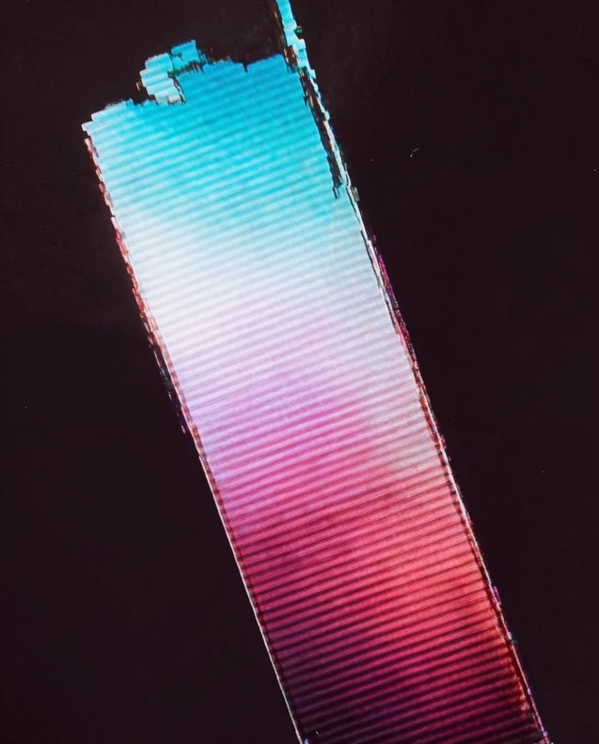 A torn band of cyan and magenta scan lines breaking across a dark screen, edges hard and misaligned