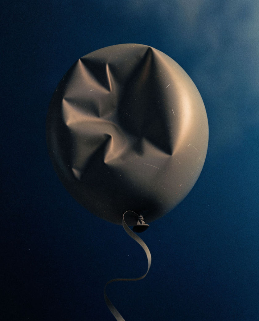 A single grey balloon losing its shape in mid-air against a deep blue field, its skin creasing inward as it sinks