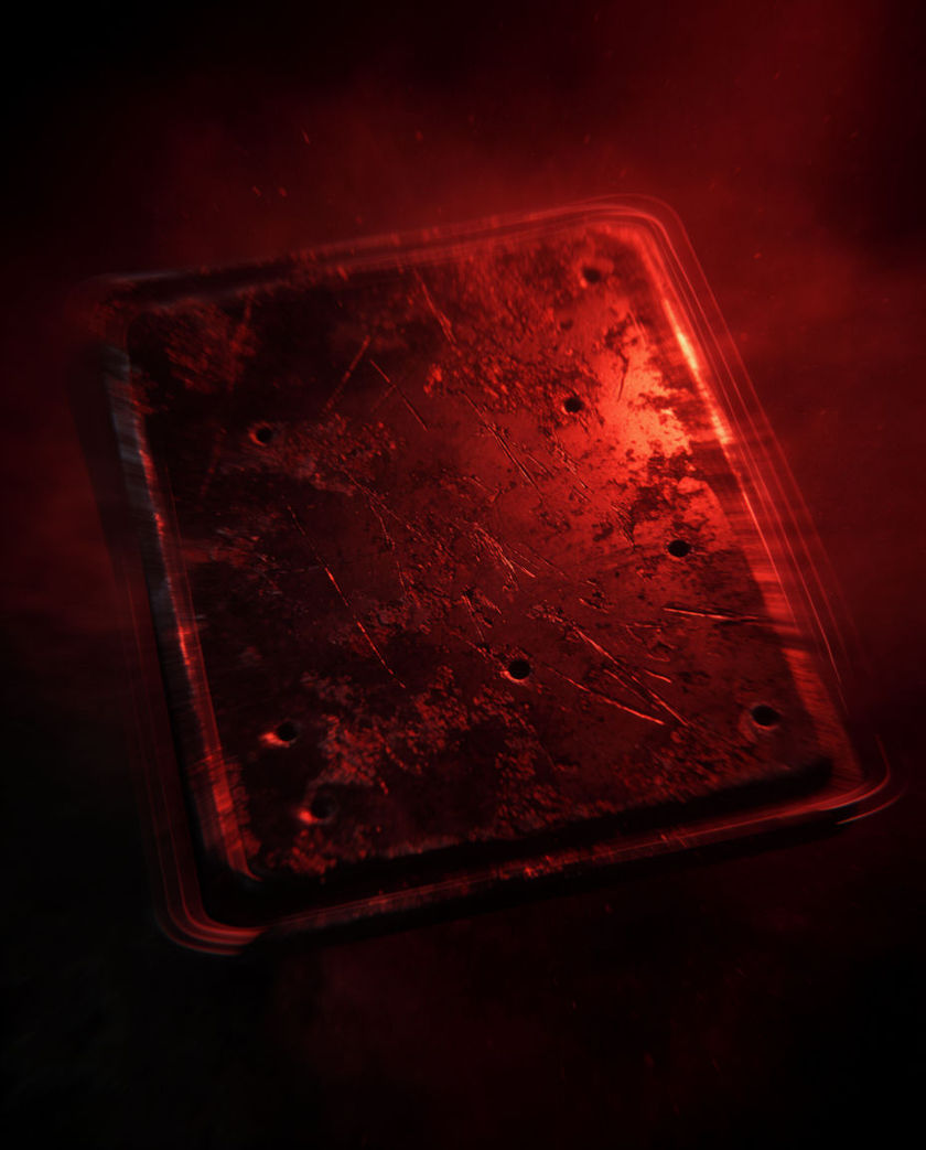A dark red-lit metal buzzer plate vibrating hard enough to blur its own edge, seen close and slightly above