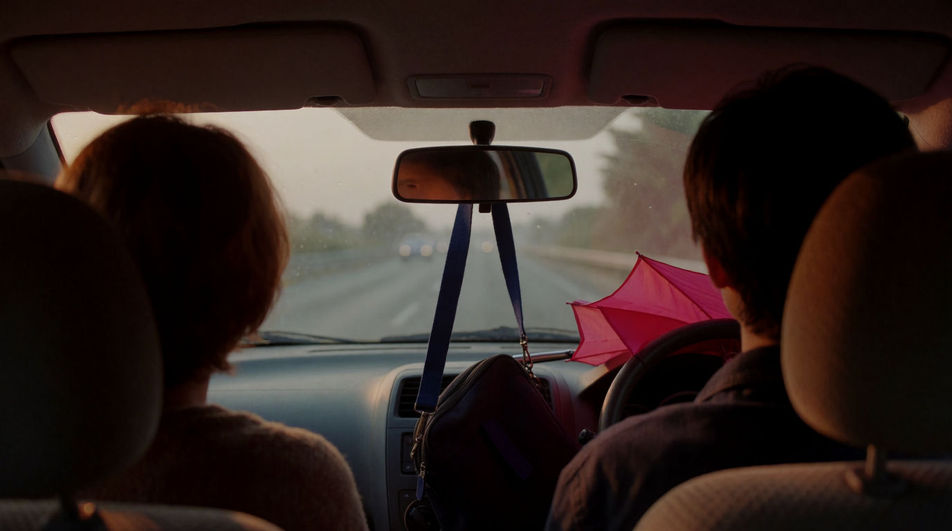 Sit under a car scene