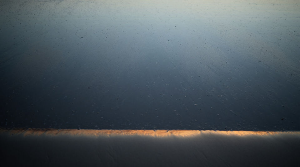 Let gentle surf give a still scene its rhythm