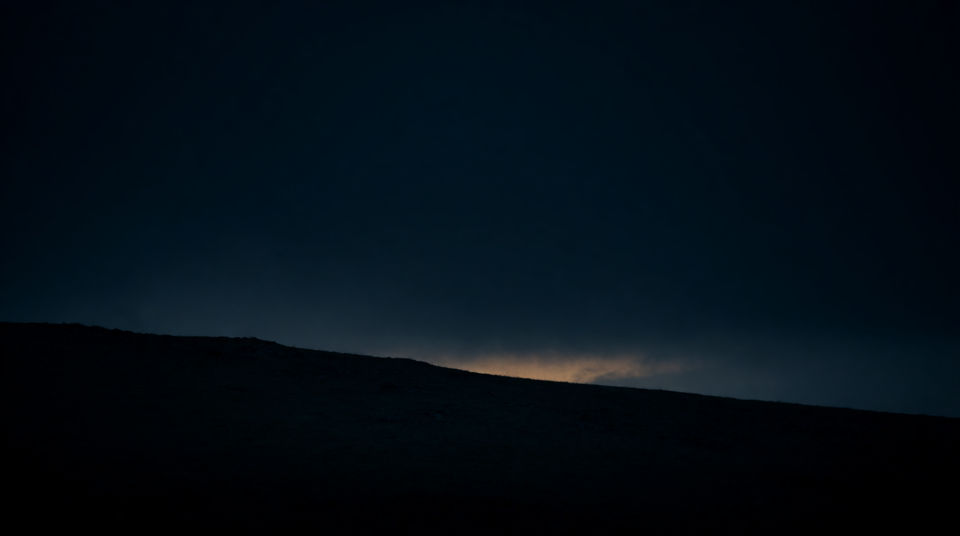 Let a far howl hold an empty ridge
