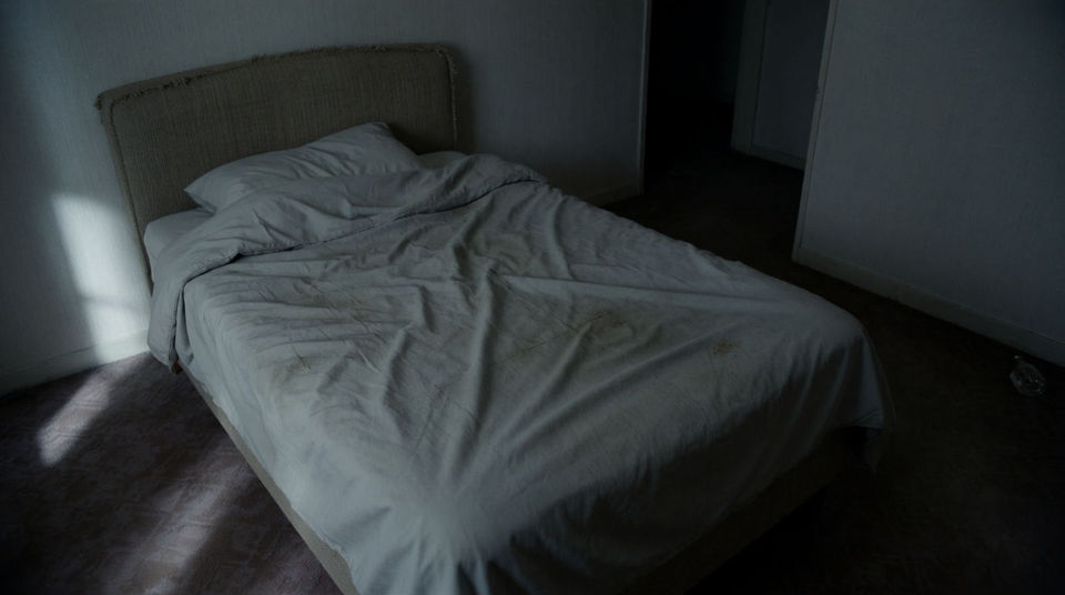 Silence in a room that should not be empty
