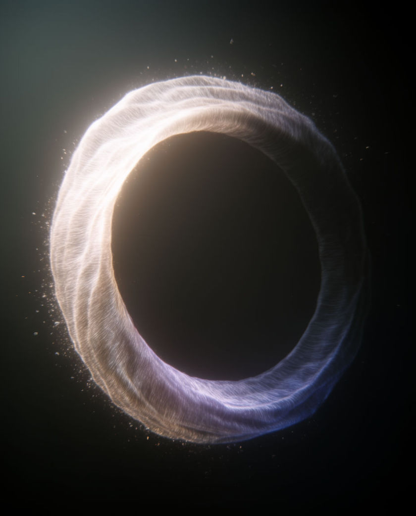 A heavy metal slab caught the instant a hammer strikes it, sparks off one warm side light against a dark ground