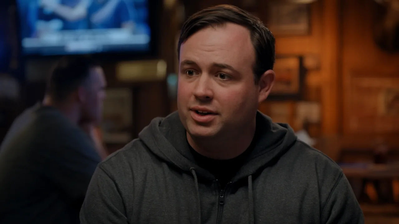 Chicago character speaking to camera in a sports bar