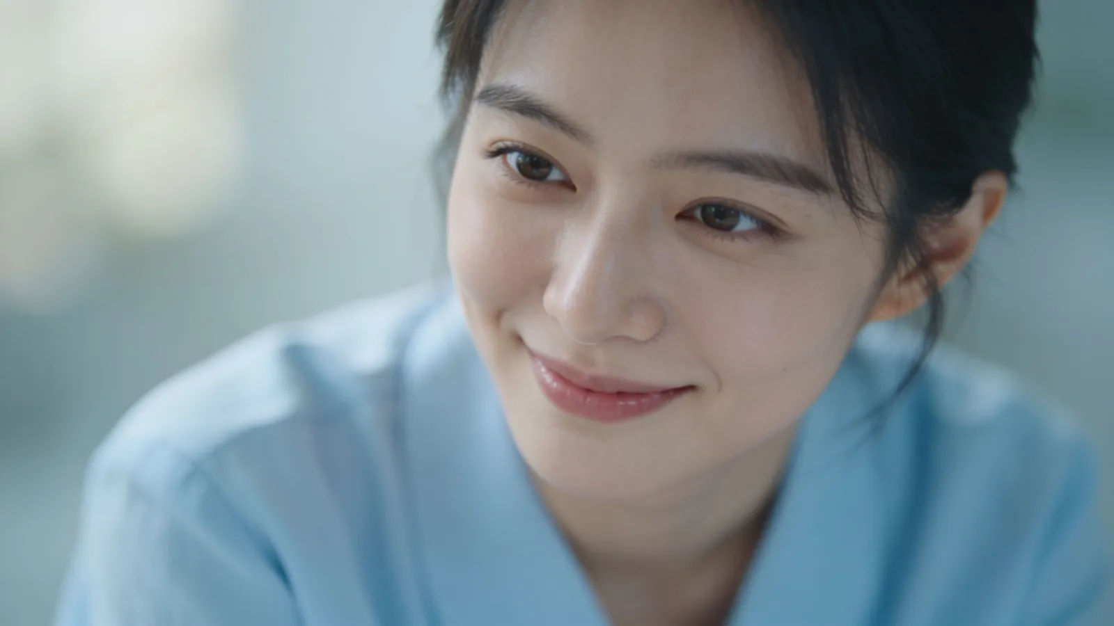 Warm caring person with gentle attentive smile