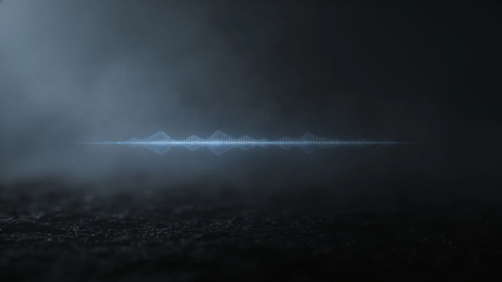 Flat dim grey-blue waveform on near-black