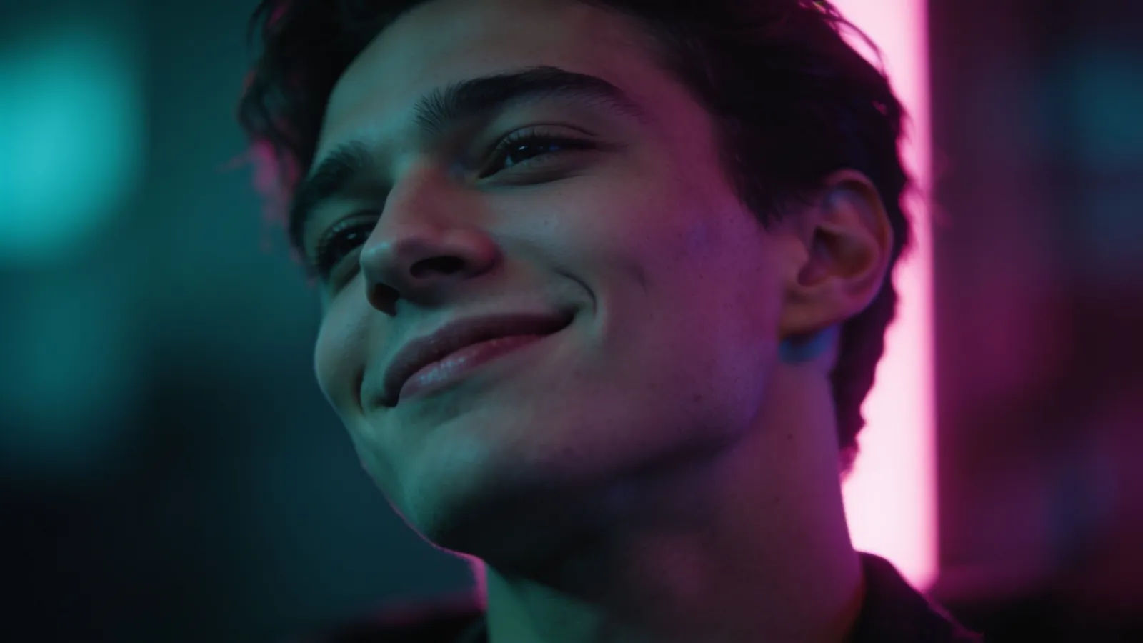 Relaxed figure with cool half-smile, neon light
