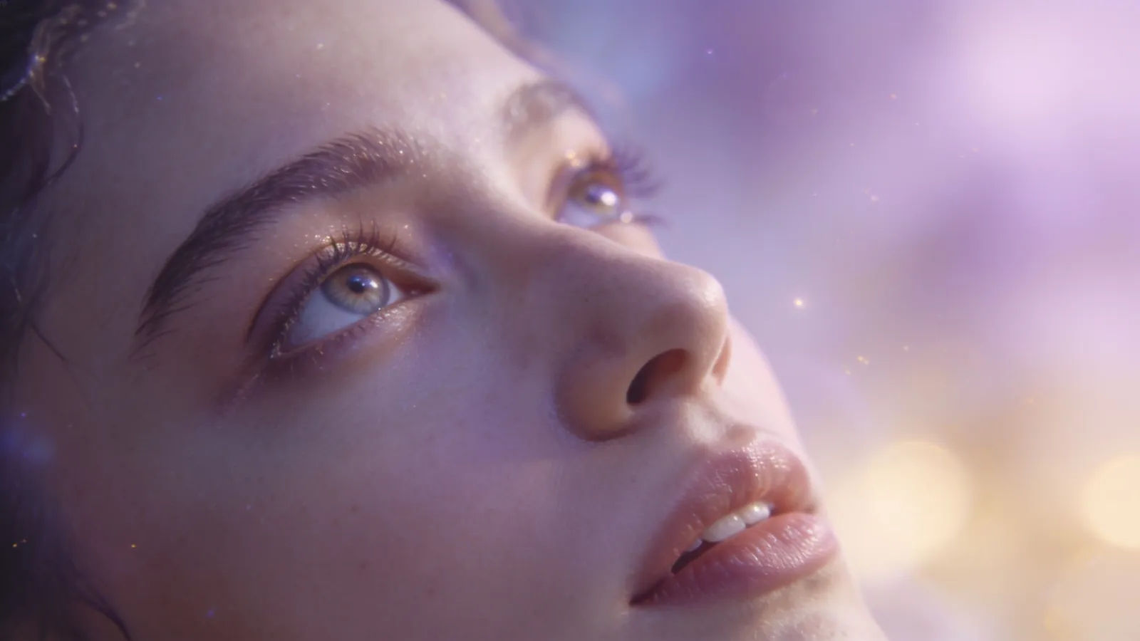 Wistful performer gazing upward in pastel haze