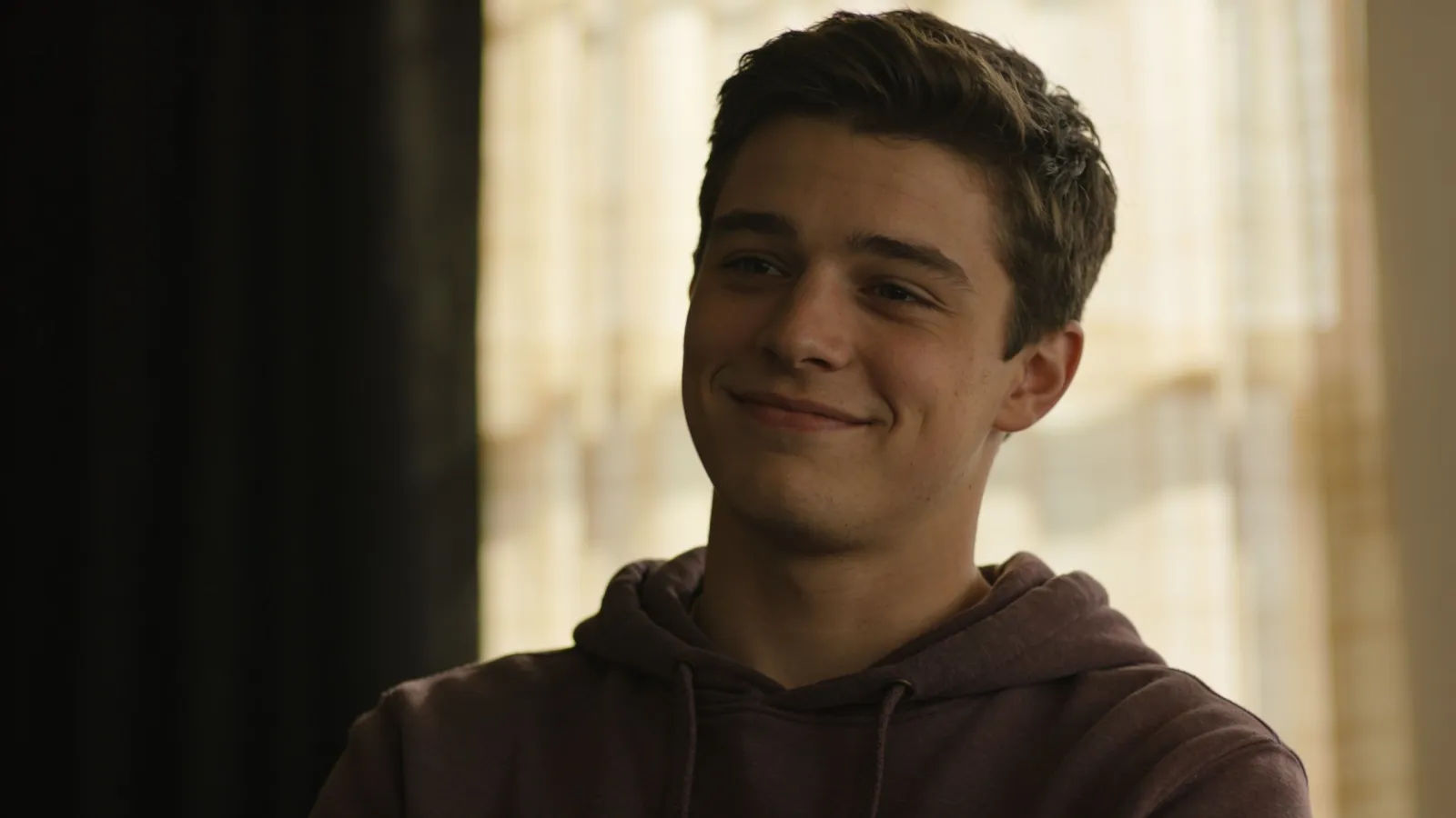 Relaxed easygoing young man in warm light