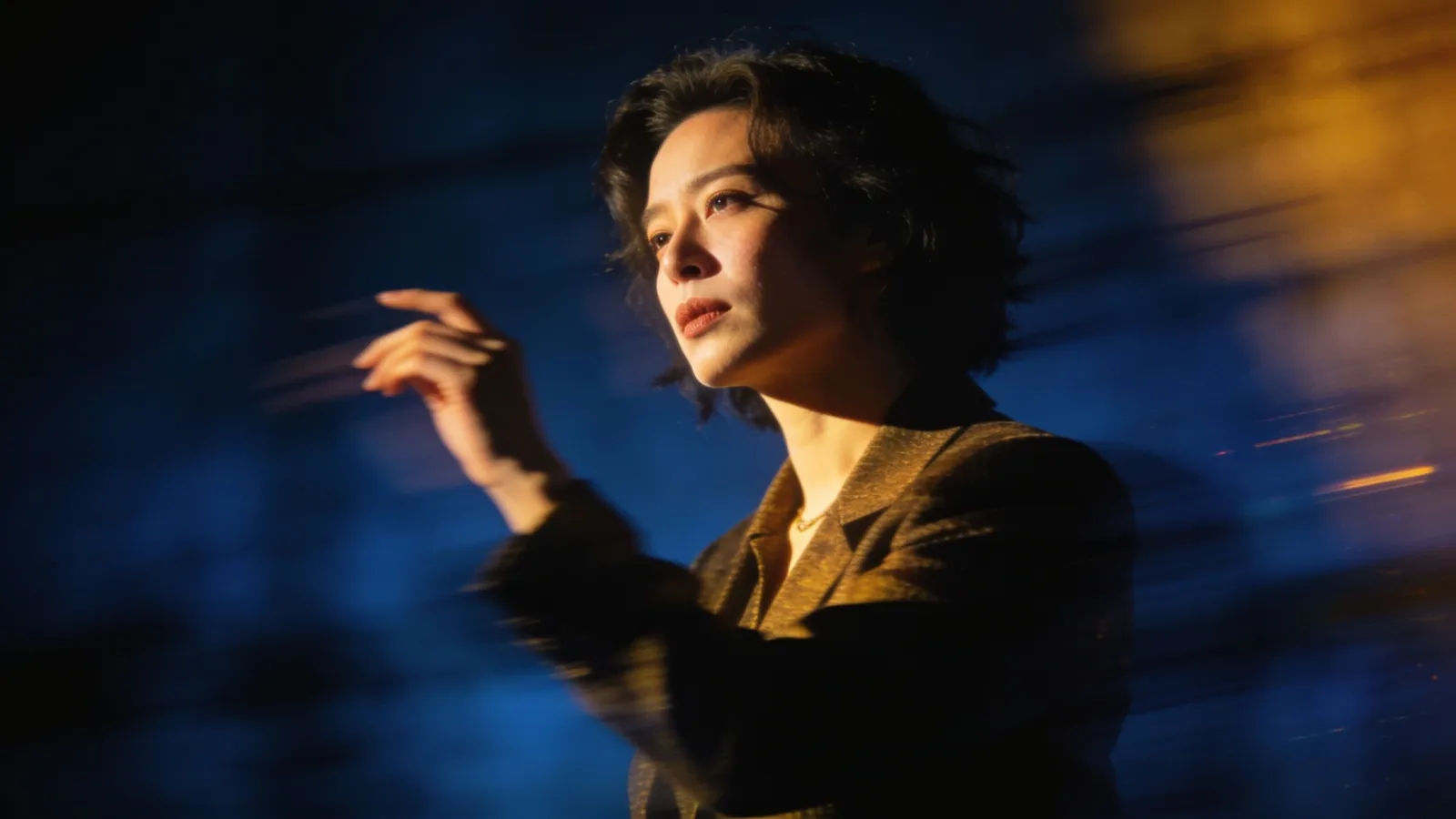 Expressive performer in dramatic key light