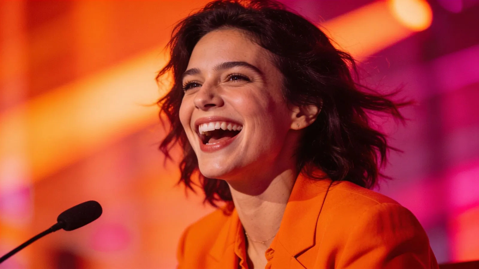 Vibrant upbeat presenter mid-laugh portrait