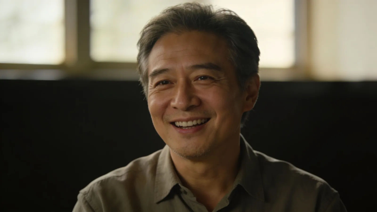 Ordinary friendly middle-aged man in warm light