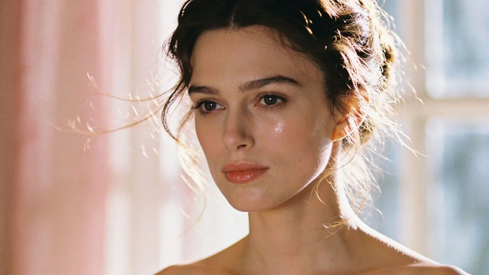 Graceful woman in soft rose-cream natural light
