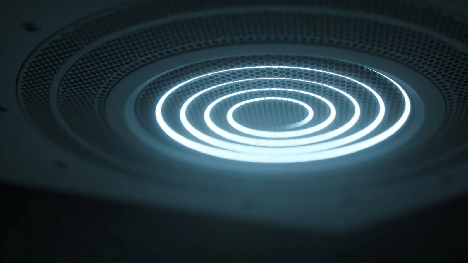 PA speaker grille with glowing sound rings