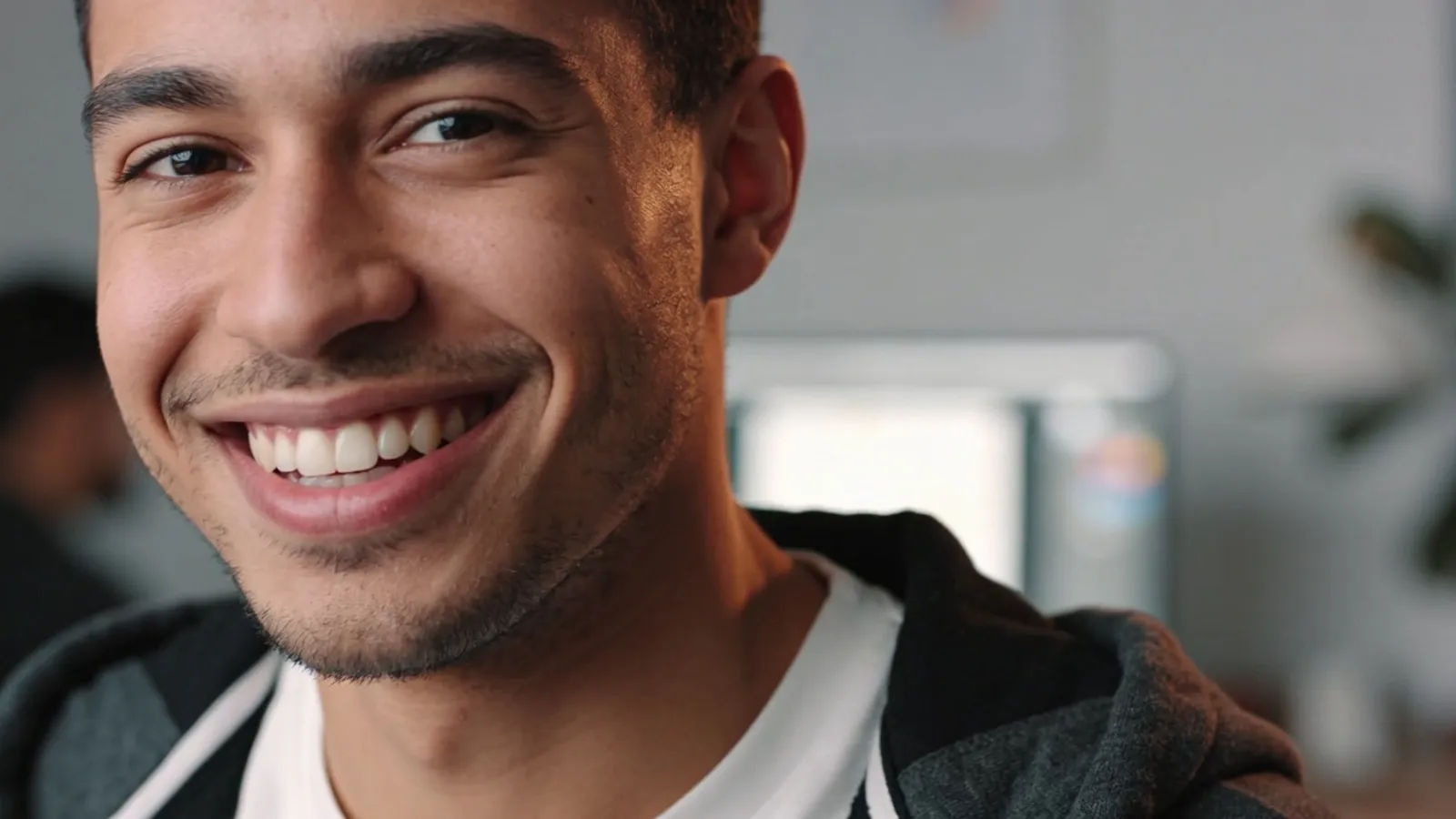 Upbeat young millennial creator with bright smile