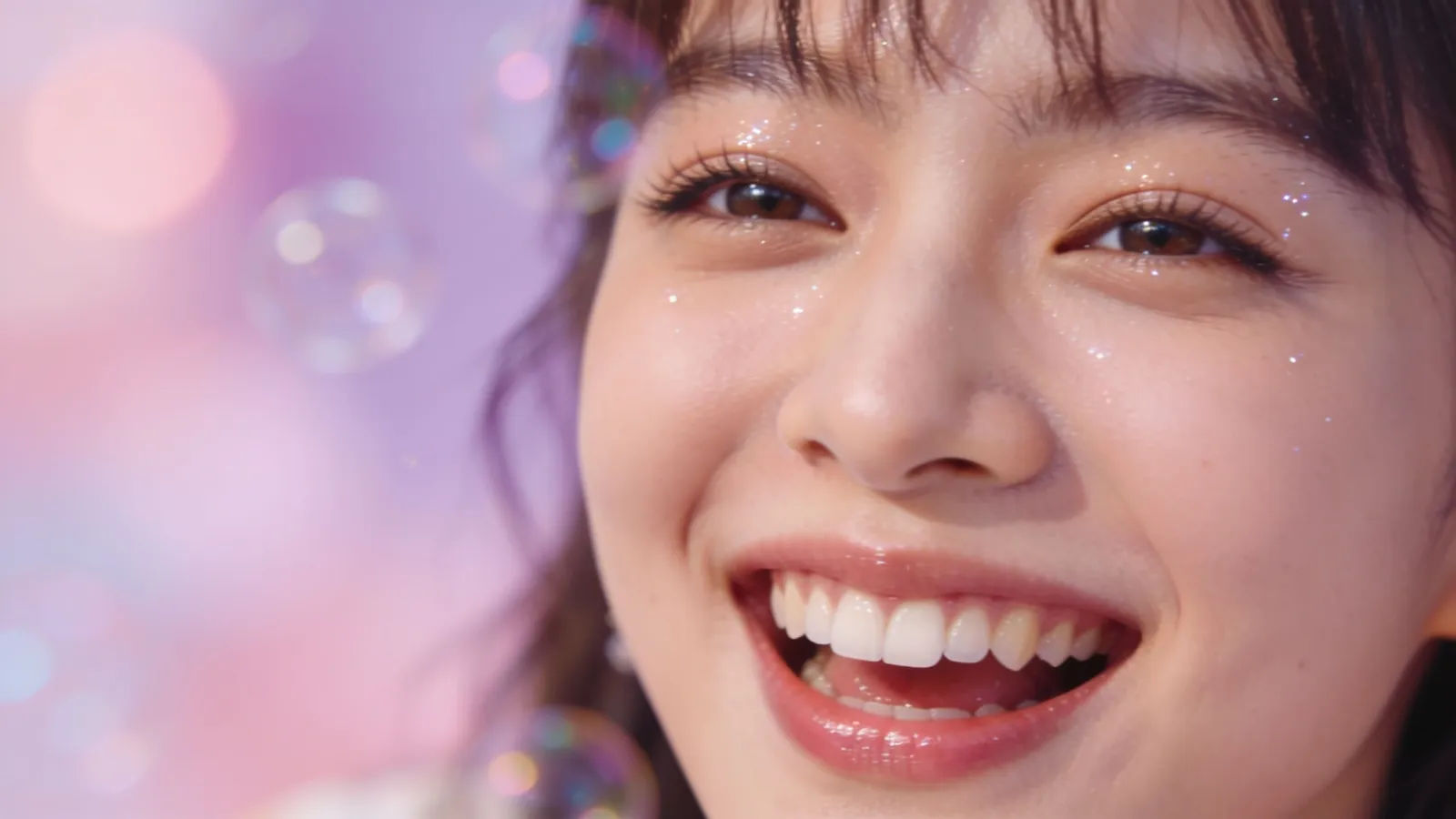 Bubbly young woman mid-giggle in pastel light