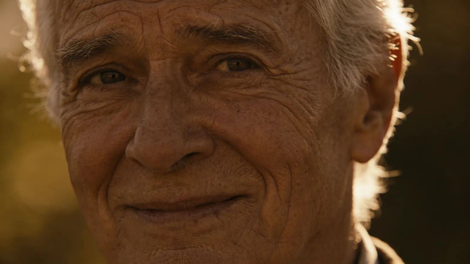 Weathered elderly man with kind warm smile