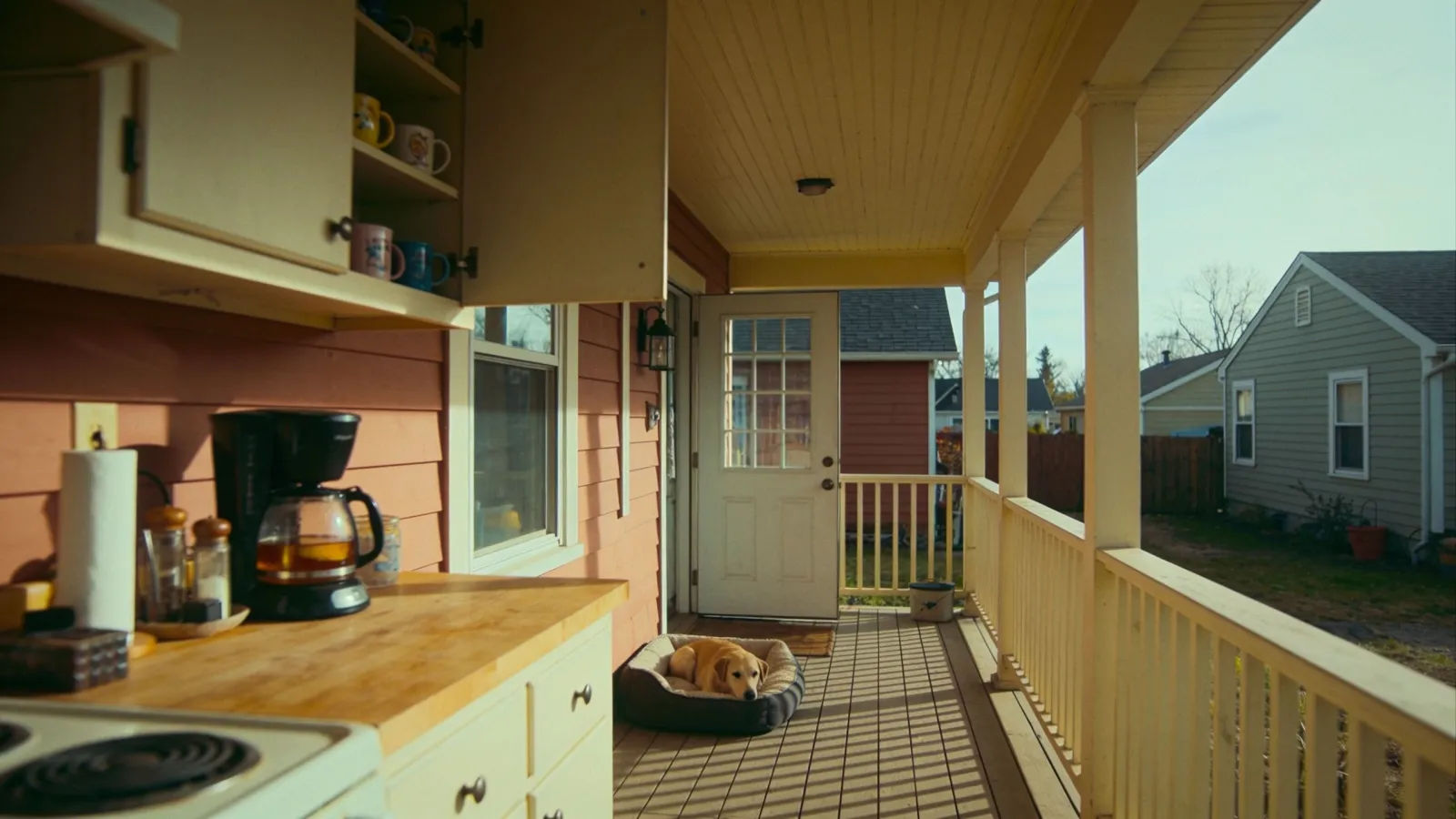 Cozy suburban home kitchen and sunlit porch