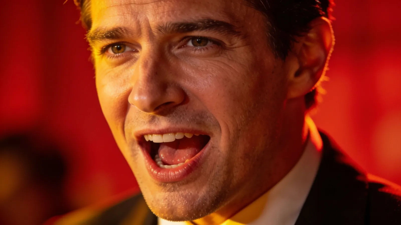 Energetic pitchman presenter mid-pitch, punchy dramatic light