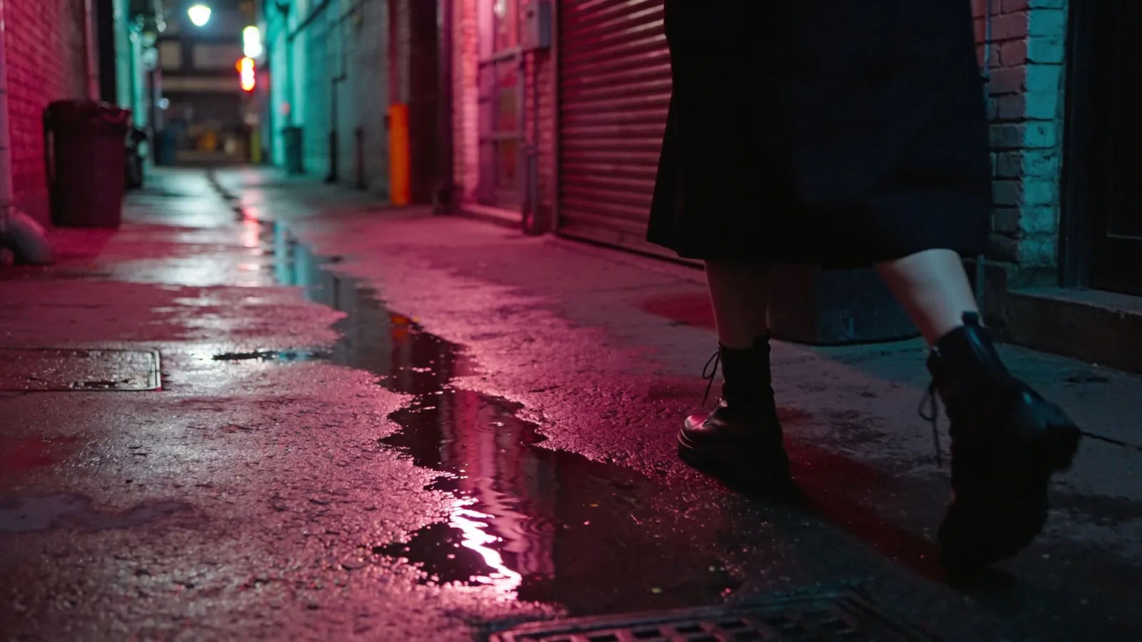 Moody neon-lit urban alley with wet pavement