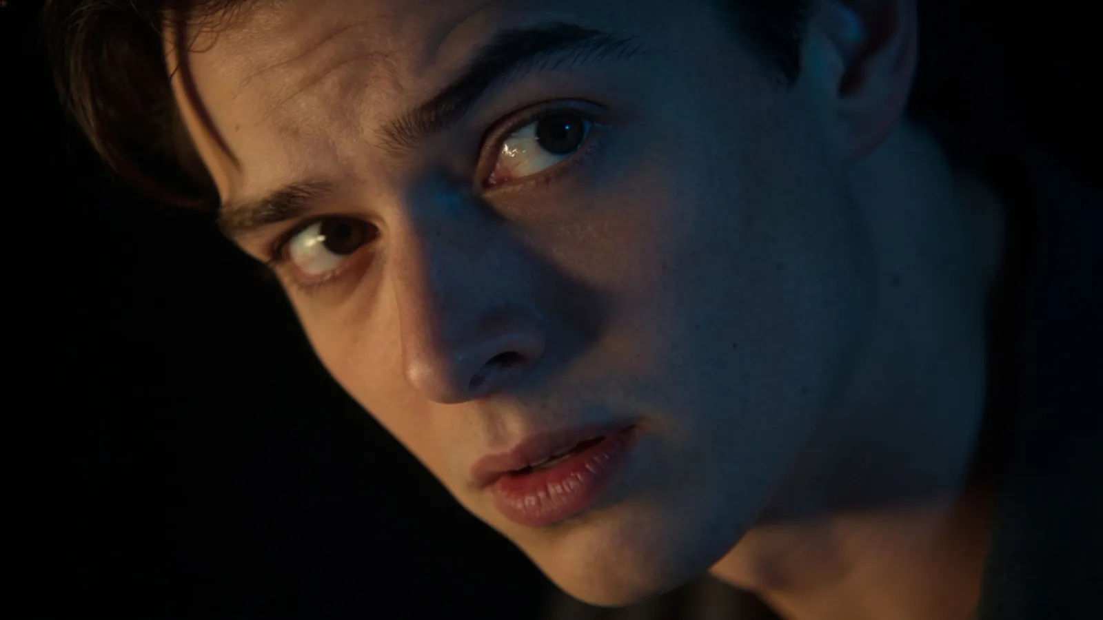 Curious person with raised eyebrow and questioning gaze