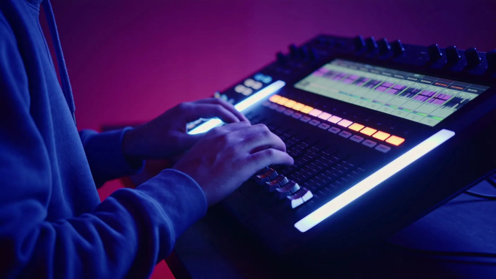 Hands tilting audio sliders, moody lighting