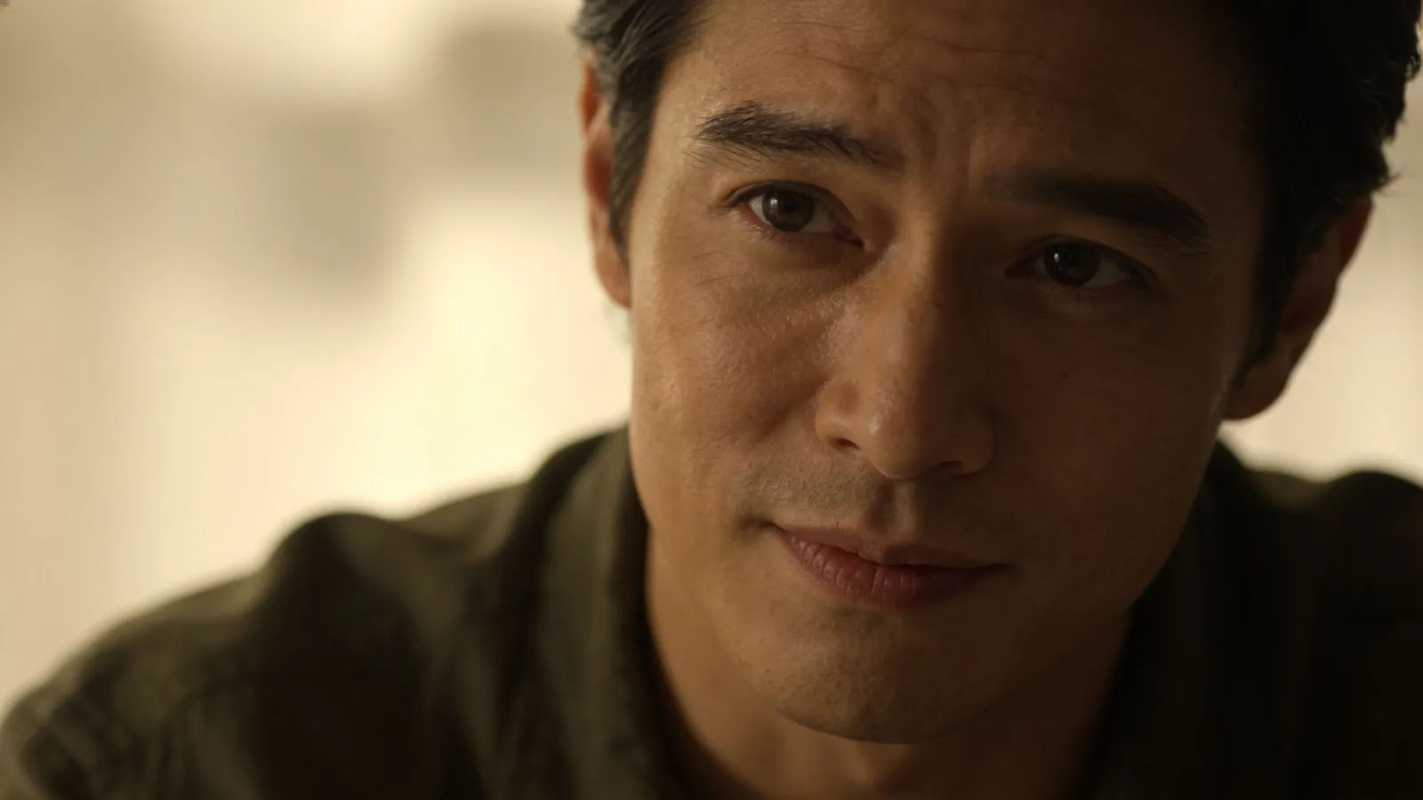 Warm confident expert in soft cinematic portrait