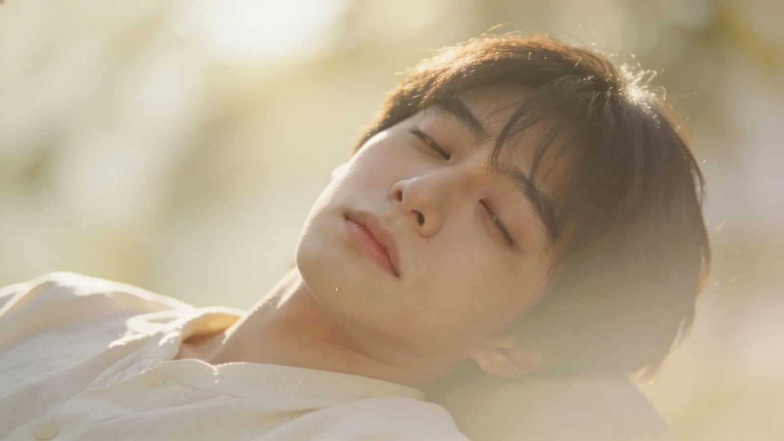 Relaxed slouching half-asleep character in warm light