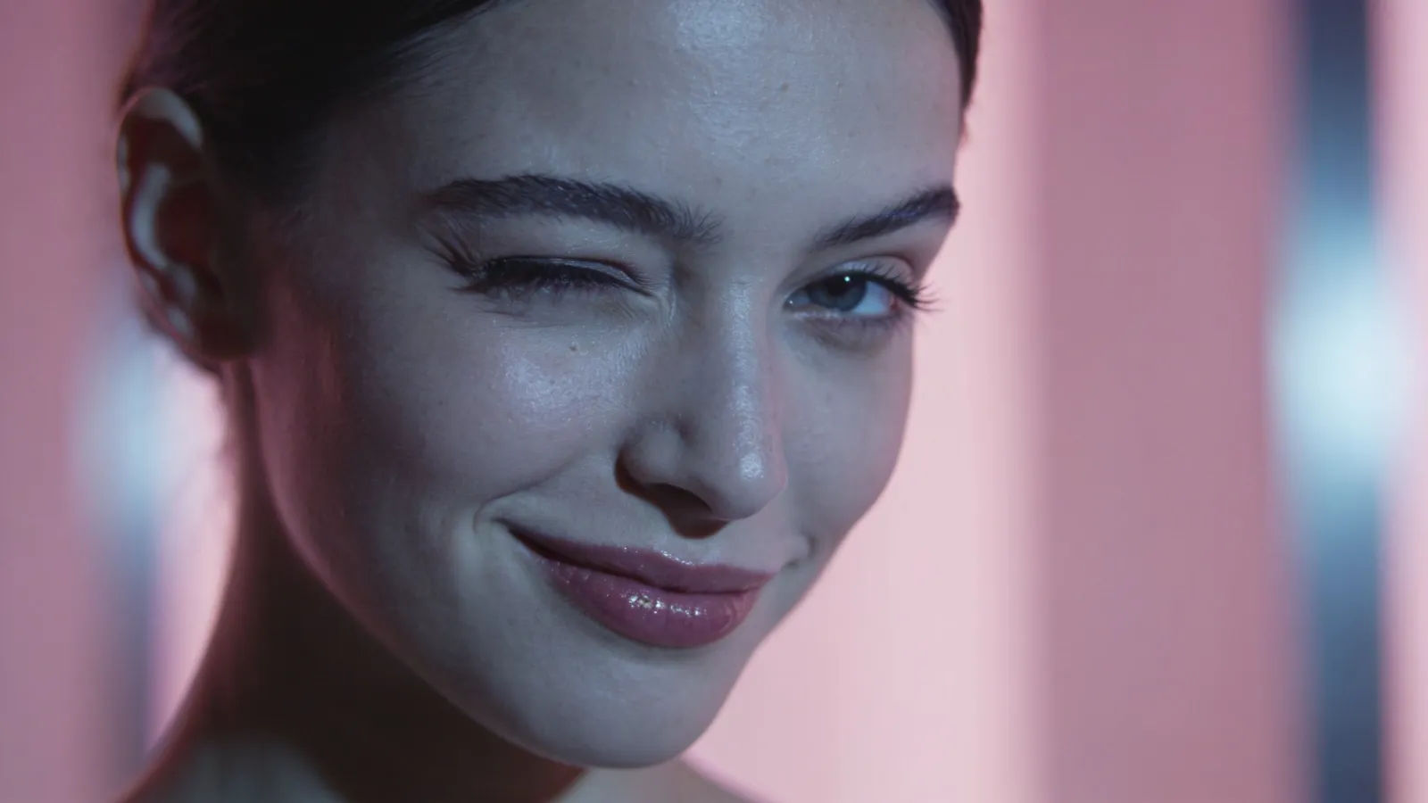 Confident young woman with cool smug smirk, portrait