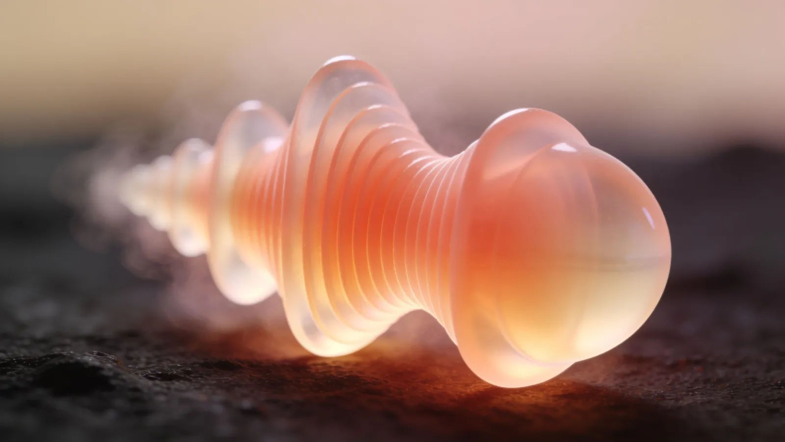 Smooth coral and cream audio waveform on black