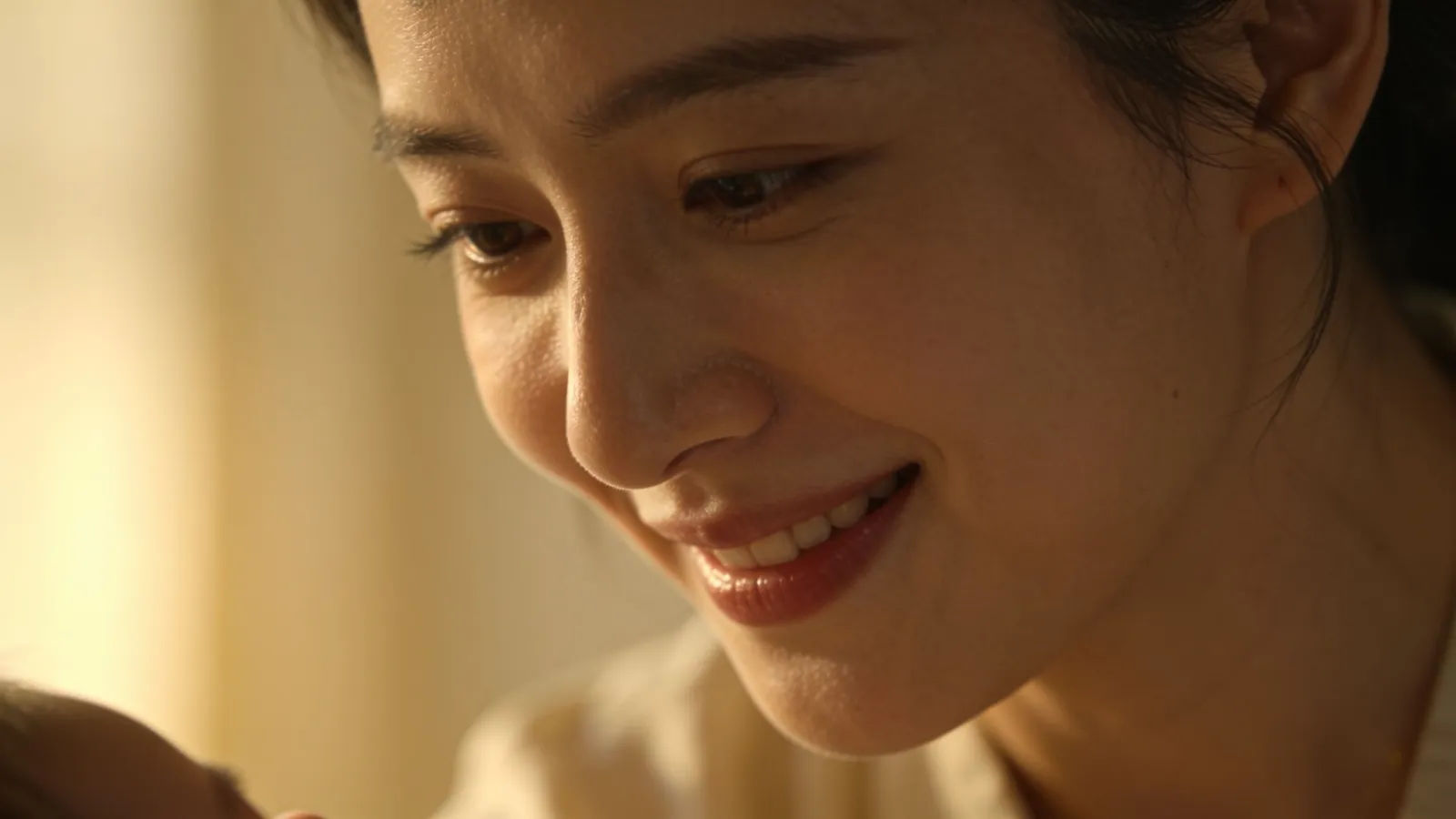 Tender warm caregiver with gentle reassuring smile