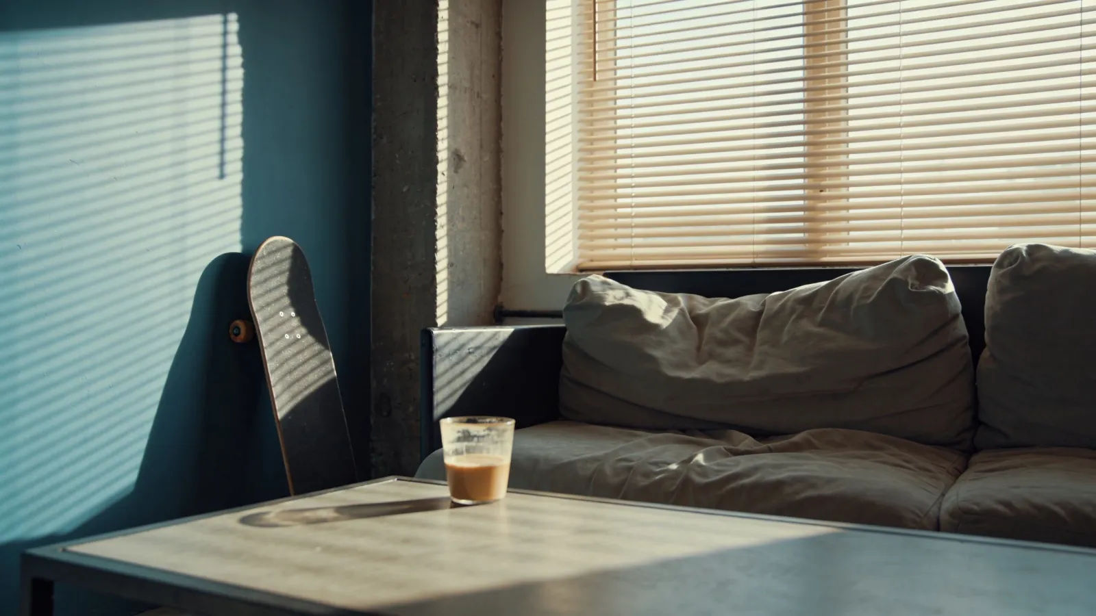 Laid-back sunlit loft corner with slouchy couch