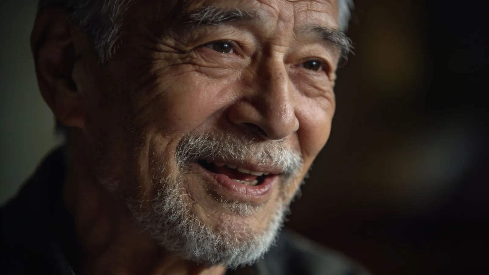 Weathered elderly man with silver beard speaking