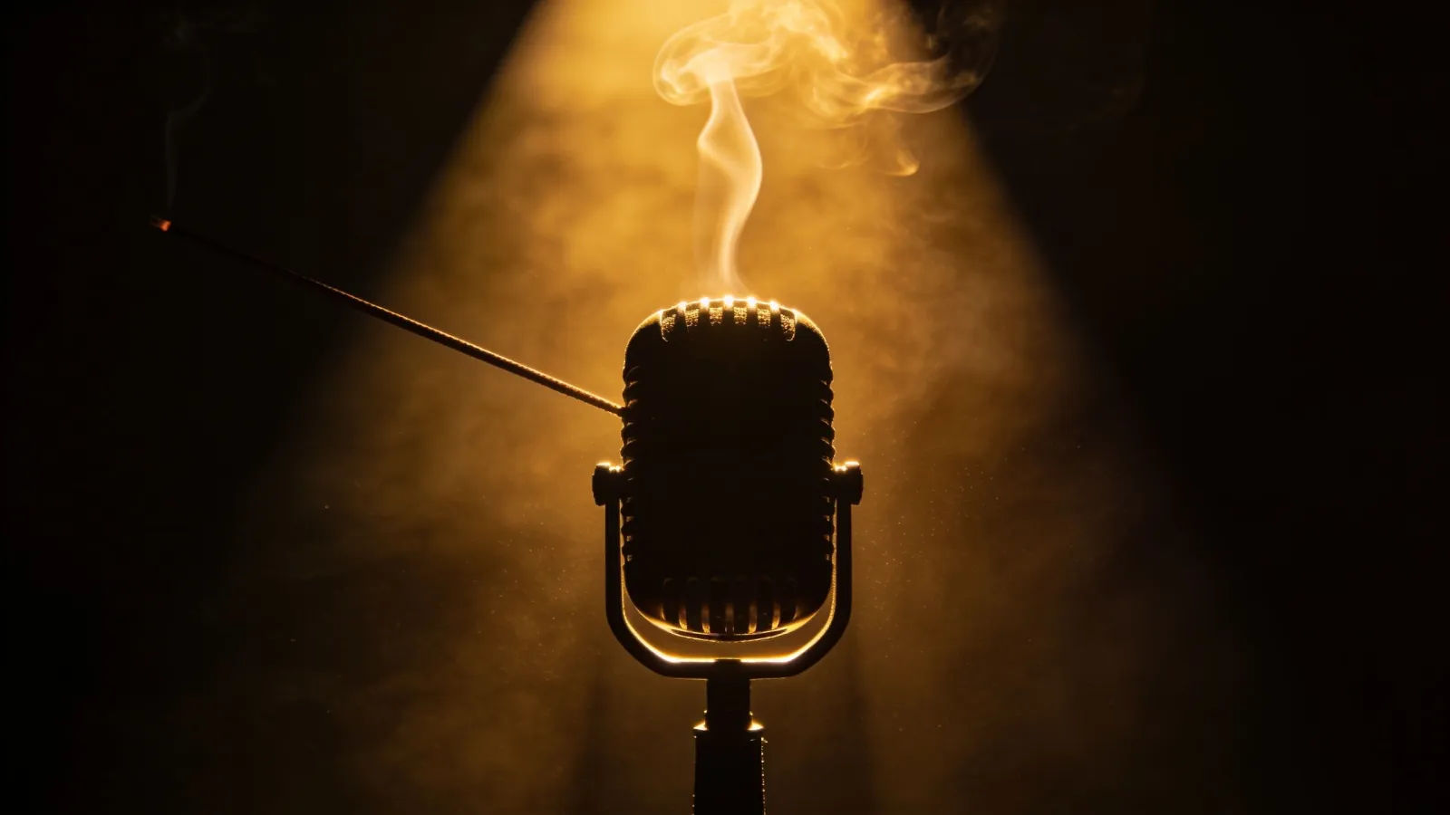 Amber waveform and vintage microphone in smoke