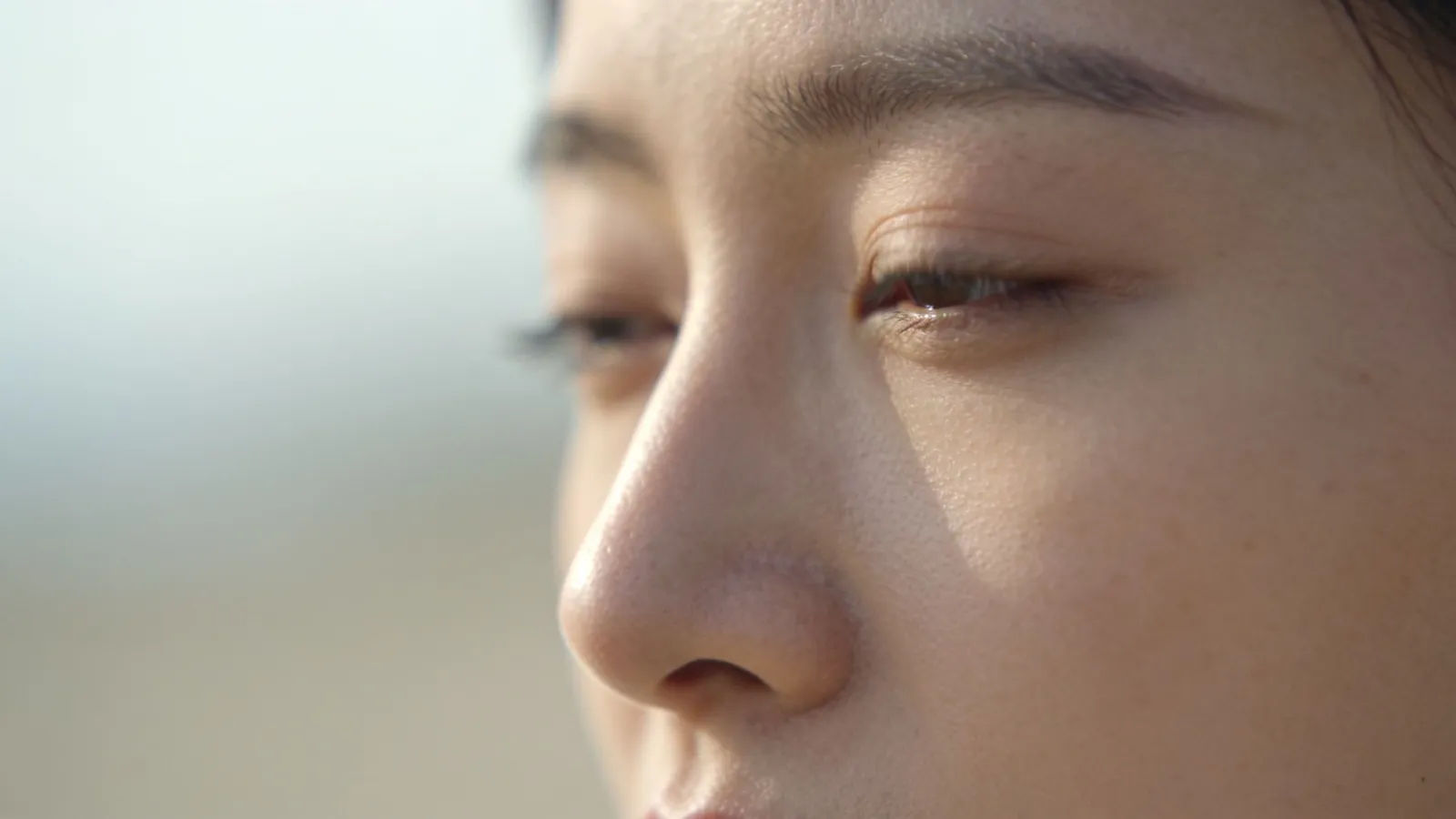 Serene person with soft calm expression