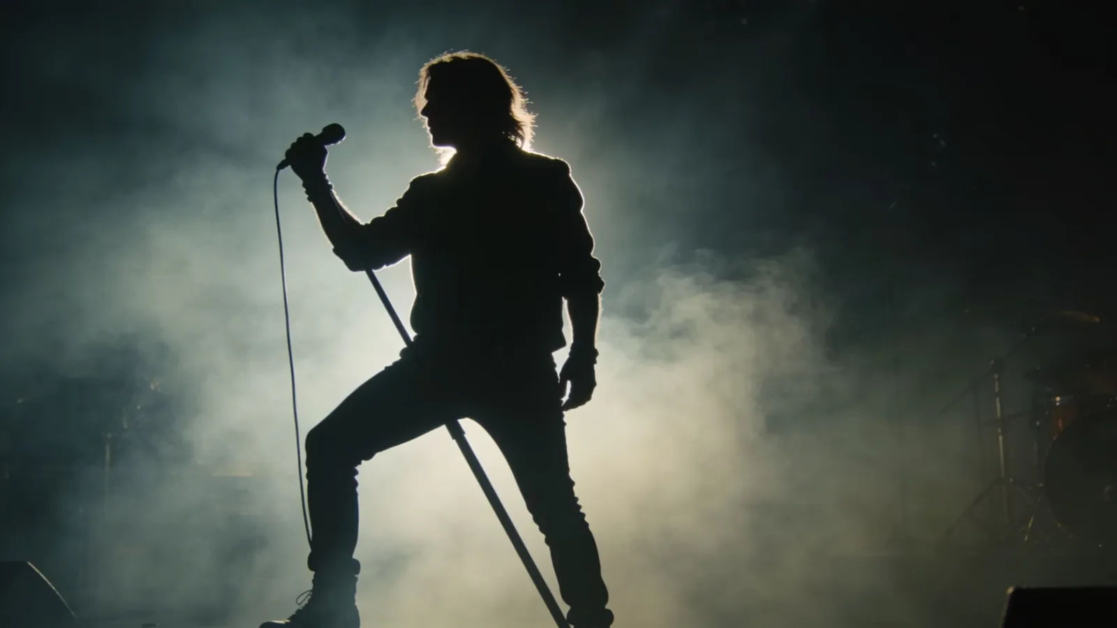 Rock performer silhouette backlit by stage haze