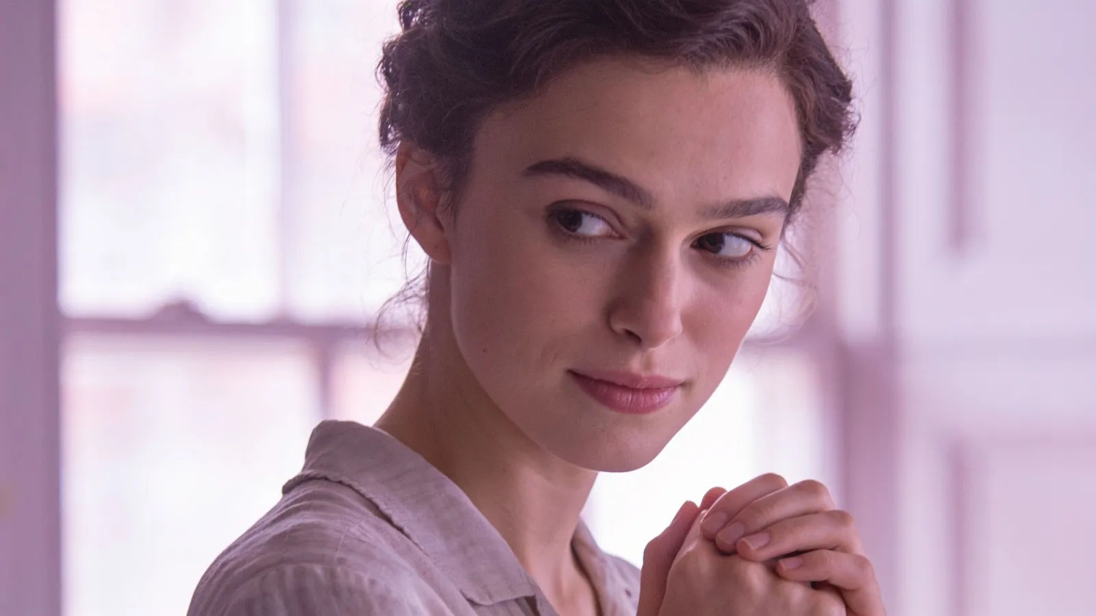 Timid soft-spoken person glancing gently away, portrait