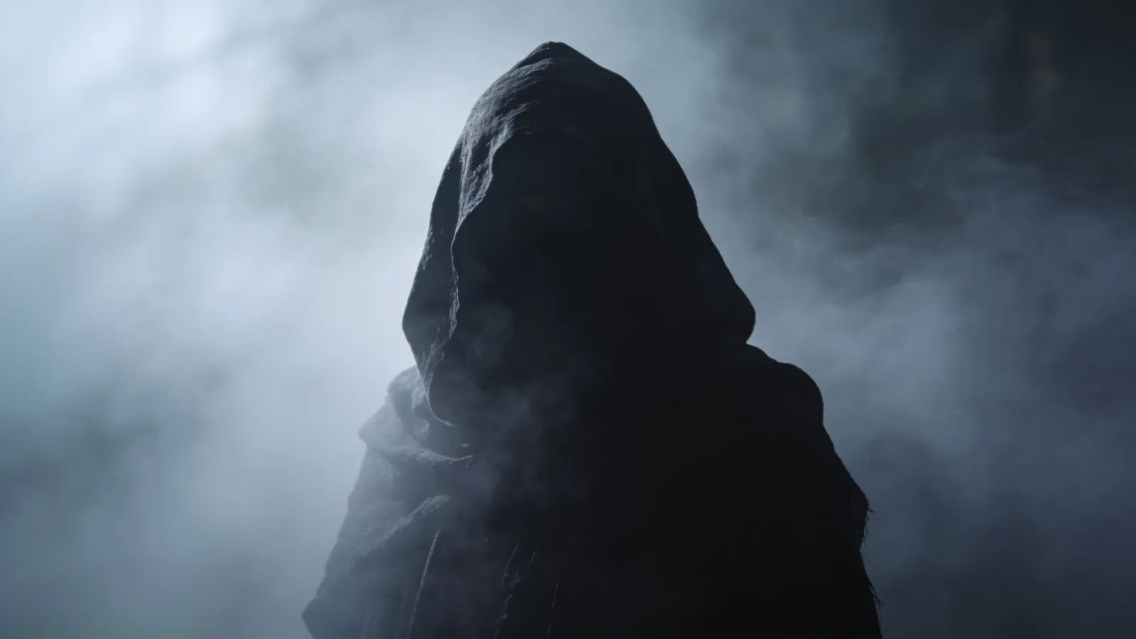 Cloaked shadowy figure in drifting fog