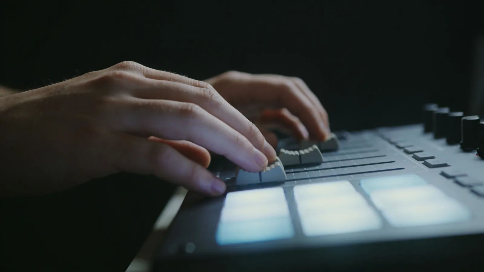 Calm hands on minimal console with pale audio UI