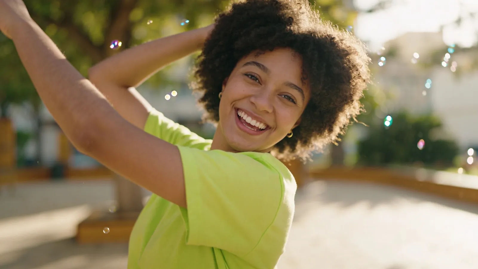 Bubbly upbeat young person with playful smile