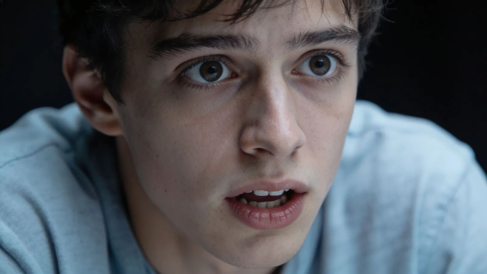 Timid nervous young man with anxious wide eyes