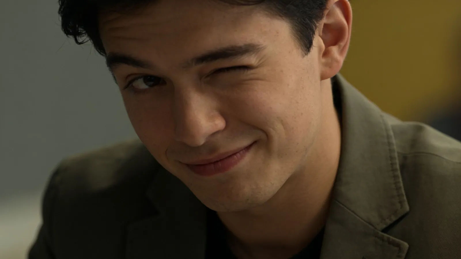 Clever young adult with a sly knowing smile
